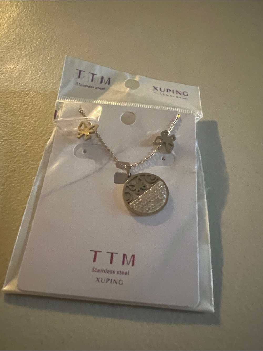 Ping Silver-Tone Round Filigree Pendant Necklace with Crystal Accent